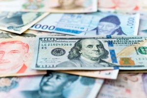 Debito emergente, sfruttare la dispersione tra valuta forte e valuta locale