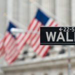 Record a Wall Street, ma scatta un allarme di liquidità